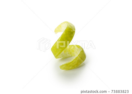 Ripe lime peel isolated on white background Ripe lime peel isolated on white background 73883823