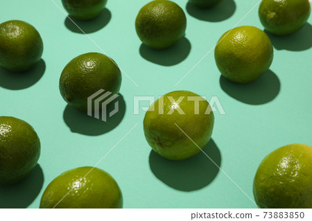 Flat lay with ripe lime on mint background 73883850
