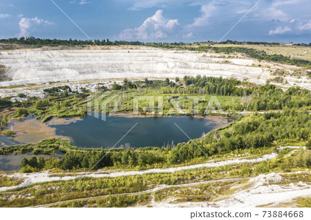 Abandoned quarry in Volsk with a beautiful lake at the bottom. 73884668