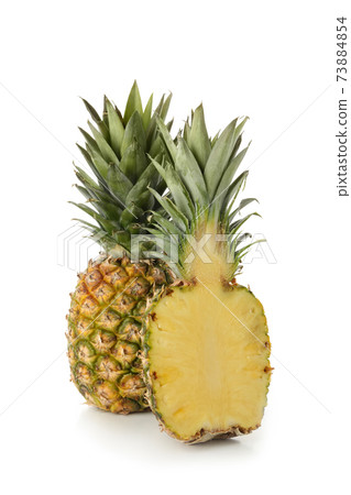 Tasty ripe pineapples isolated on white background 73884854