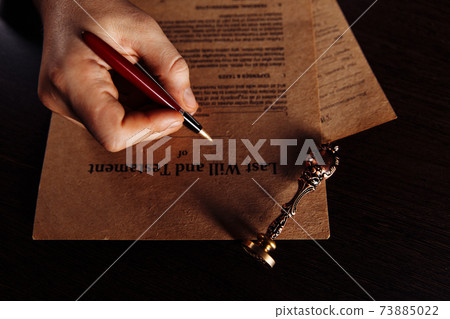 Notary public in office approves documents. Top view Notary public in office approves documents. Top view 73885022