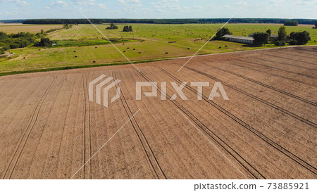 Plowed fields of Russia. Aerial drone view. 73885921
