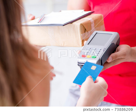 Parcel delivery being paid with pos and credit card Parcel delivery being paid with pos and credit card 73886209