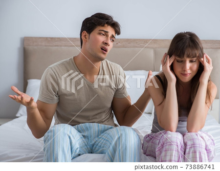 Woman and man in the bedroom Woman and man in the bedroom 73886741