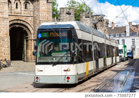 City tram in Gent in a beautiful summer day, Belgium 73887277