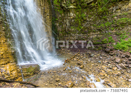 Waterfall in Carpathian mountain 73887491