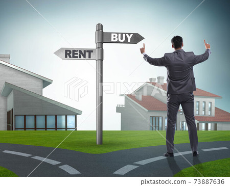 Businessman at crossroads betweem buying and renting 73887636