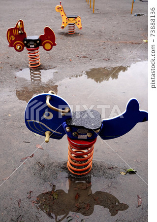 Playground equipment After the rain Puddle Playground equipment After the rain Puddle 73888136