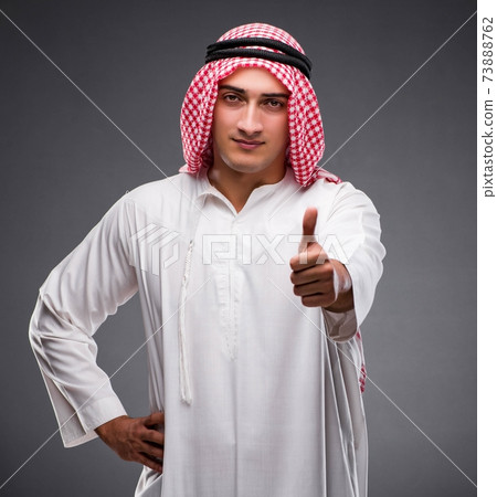 Arab businessman on gray background 73888762