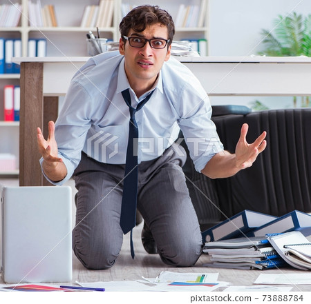 Bankrupt businessman angry in the office floor Bankrupt businessman angry in the office floor 73888784