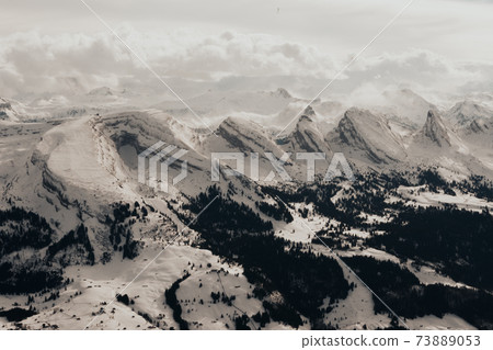 Snow covered swiss alps from above view of mountain Saentis 73889053
