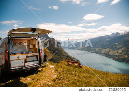 Vanlife - Camping Van on a mountain in Switzerland 73889055