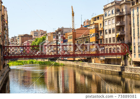Colorful houses and Eiffel bridge in Girona Colorful houses and Eiffel bridge in Girona 73889381