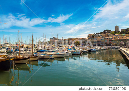 Yachts anchored in port in Cannes 73889408