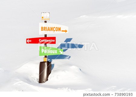 Directional board post at ski resort on sunny winter day Directional board post at ski resort on sunny winter day 73890193