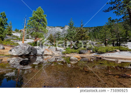 Sunny view of the Horsetail Fall Trail at Lake Tahoe Sunny view of the Horsetail Fall Trail at Lake Tahoe 73890925