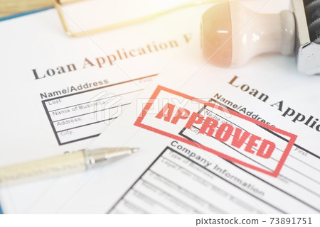 Loan application form with Rubber stamping that says Loan Approved, Financial loan money contract agreement company credit or person loan approval Loan application form with Rubber stamping that says Loan Approved, Financial loan money contract agreement company credit or person loan approval 73891751
