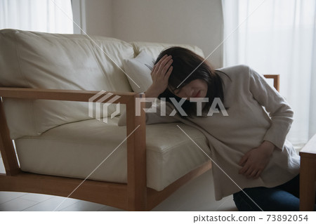 Image of a woman who is ill or depressed Image of a woman who is ill or depressed 73892054
