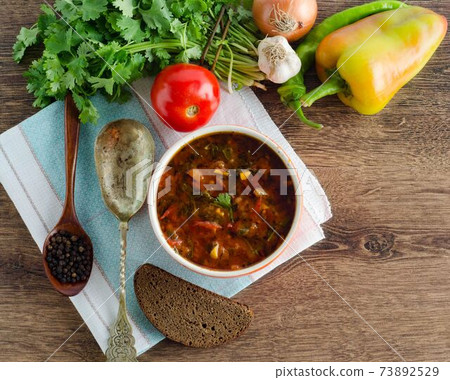 Bowl of traditional soup Borscht on table 73892529