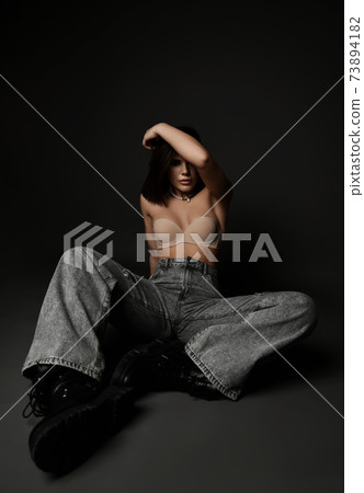 Sexy brunette woman wearing pearl necklace, bra 73894182