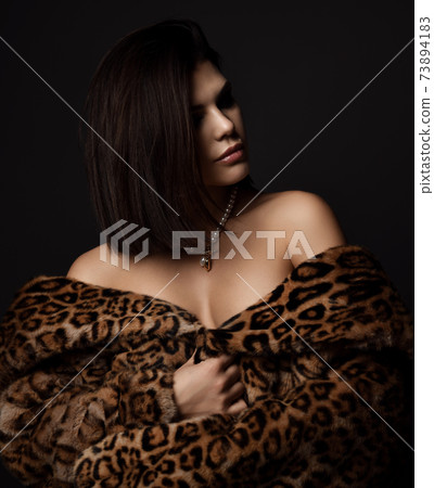 Portrait of young rich sexy brunette woman in 73894183