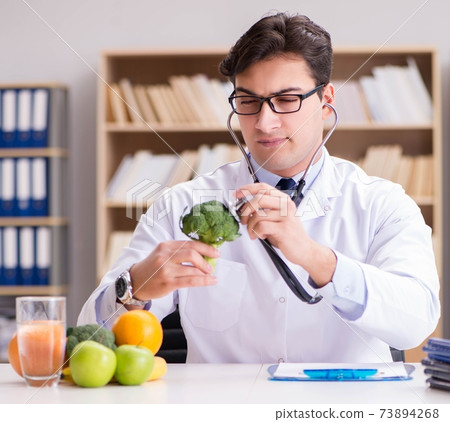 Doctor in GMO food concept 73894268
