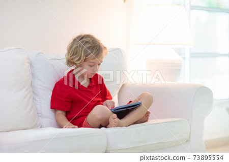 Child with tablet computer. Kids study online. Child with tablet computer. Kids study online. 73895554