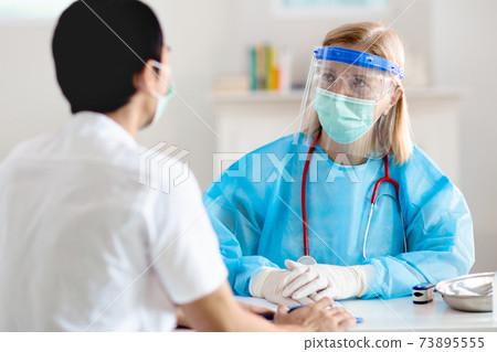 Coronavirus outbreak. Doctor and covid-19 patient. 73895555