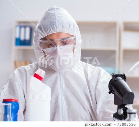 Chemist checking the quality of bathroom supplies 73895556