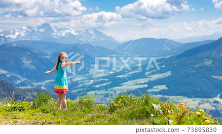 Children hiking in Alps mountains. Kids outdoor. Children hiking in Alps mountains. Kids outdoor. 73895830