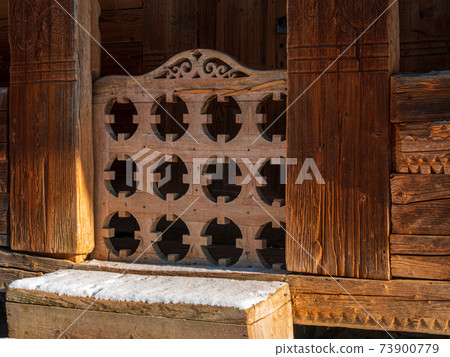 Vintage brown country wooden house gate. Antique traditional building exterior. Travel photo. Retro rustic wood boards. 73900779
