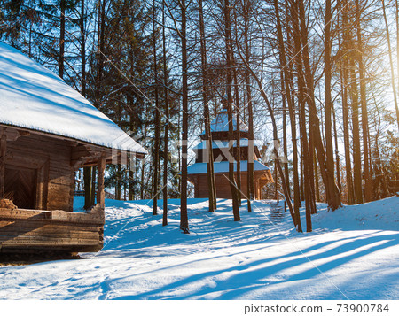 Wooden vintage country house in mountains forest covered snow on nature landscape. Active rest. Snowy winter holidays. Wooden vintage country house in mountains forest covered snow on nature landscape. Active rest. Snowy winter holidays. 73900784