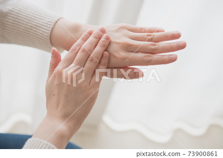 Image of wearing hand cream on the hands of women who do hand care Image of wearing hand cream on the hands of women who do hand care 73900861