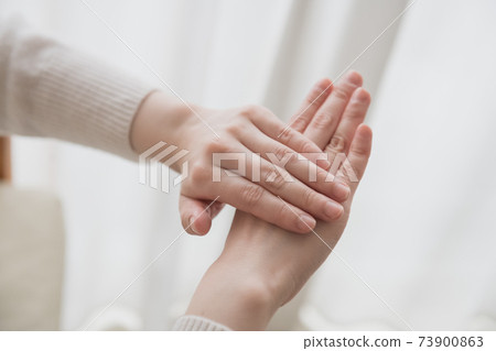 Image of wearing hand cream on the hands of women who do hand care Image of wearing hand cream on the hands of women who do hand care 73900863