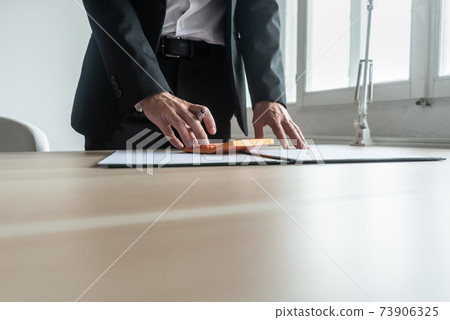 Financial advisor making quick calculations Financial advisor making quick calculations 73906325