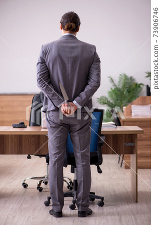 Young businessman employee in bullying concept in the office Young businessman employee in bullying concept in the office 73906746