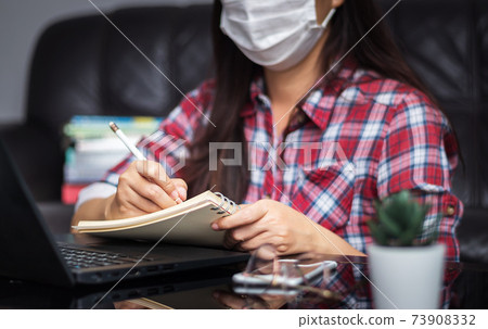 new normal, work from home, study online, homeschooling, distance education. student wear hygienic protect face mask study online listen lecture via laptop at home during coronavirus Covid-19 epidemic 73908332