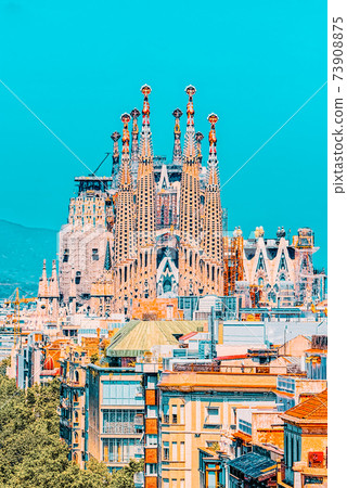 Basilica of La Sagrada Familia against blue sky. Creations of th Basilica of La Sagrada Familia against blue sky. Creations of th 73908875
