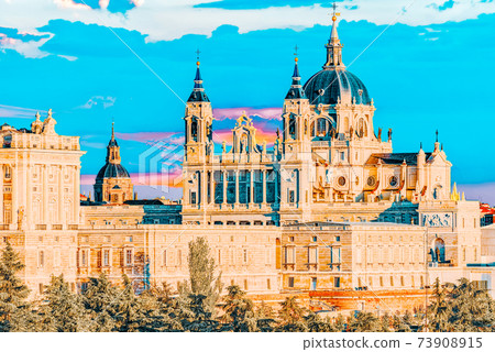Panorama view on Royal Palace (Palacio Real) in the capital of Spain - beautiful city Madrid from a bird's eye view. Panorama view on Royal Palace (Palacio Real) in the capital of Spain - beautiful city Madrid from a bird's eye view. 73908915