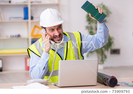 Young neck injured male architect in safety concept Young neck injured male architect in safety concept 73909793