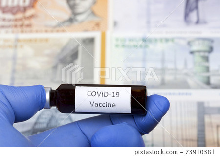Vaccine against Covid-19 on the background of Danish krone 73910381
