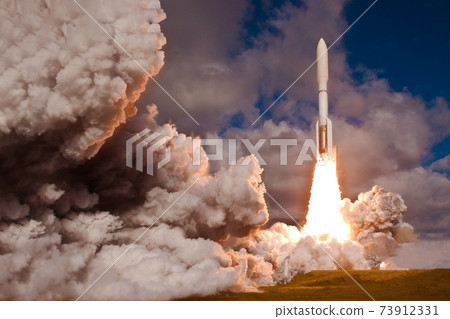 The launch of the space shuttle. With fire and smoke. Elements of this image were furnished by NASA The launch of the space shuttle. With fire and smoke. Elements of this image were furnished by NASA 73912331