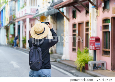 Travelers on street Phuket old town with Building Sino Portuguese architecture at Phuket Old Town area Phuket, Thailand. Travel concept 73912646