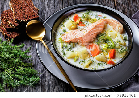 salmon fish soup with cream and veggies, top view salmon fish soup with cream and veggies, top view 73913461