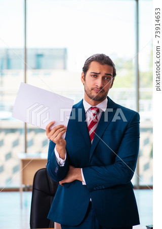 Young handsome employee working in the office Young handsome employee working in the office 73914653