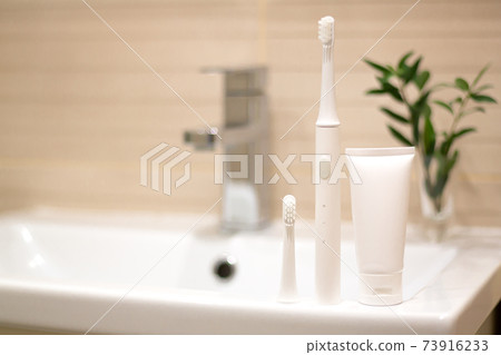 Oral hygiene and dental health concept, electric toothbrush Oral hygiene and dental health concept, electric toothbrush 73916233