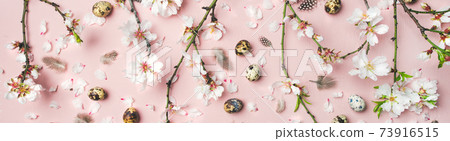 Easter background with eggs, almond flowers and Easter background with eggs, almond flowers and 73916515