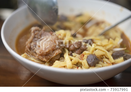 rice noodles with spicy pork sauce 73917991