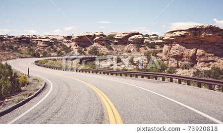 Retro toned picture of road bend, USA. 73920818