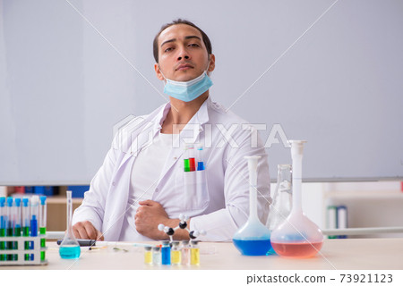 Young male chemist working in the lab Young male chemist working in the lab 73921123